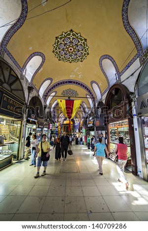 ISTANBUL - TURKEY, MAY 24. People and tourists visit and shopping in Grand bazaar on May 24, 2013. Grand Bazaar is in Fatih district of Istanbul, Turkey. It is asian style market and atracts visiters.