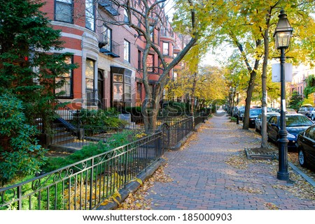 Back Bay Boston in the Fall - Red brick sidewalk and brownstones, iron fence and street lamps