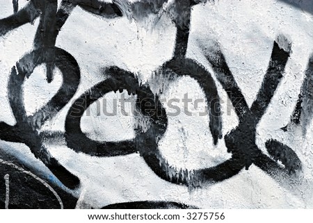 Urban grunge abstract background in black and white rock graffiti