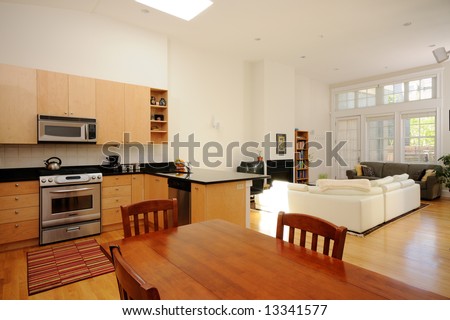 Modern dining room, kitchen and living room in open plan apartment