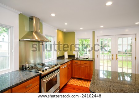Remodeled kitchen with new granite counter tops, cabinets, doors, windows, exhaust fan and appliances