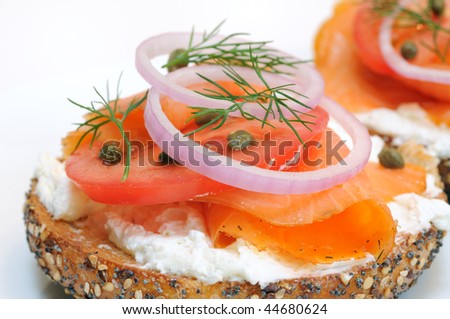 stock-photo-bagel-and-lox-smoked-salmon-cream-cheese-tomato-red-onion-capers-and-dill-44680624.jpg
