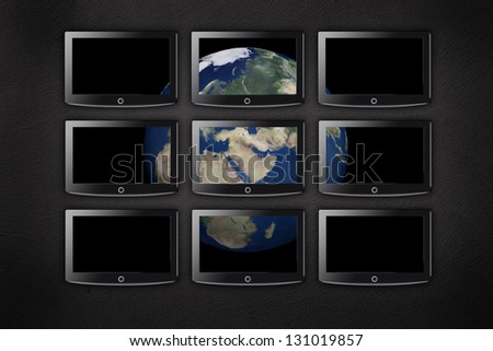 tv wall with earth on it. Elements of this image furnished by NASA.