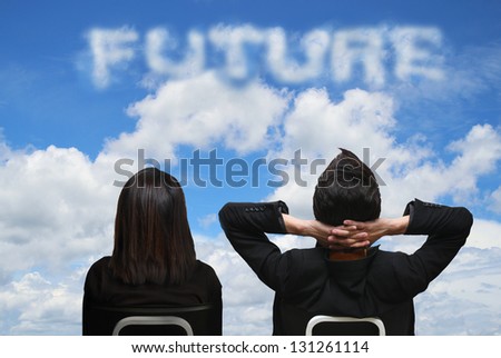 Back view of business team look into the future cloud word