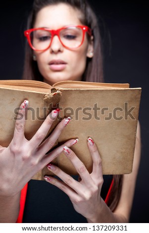 Photo Of Beautiful Woman Reading A Book - Focus On Book Cover.