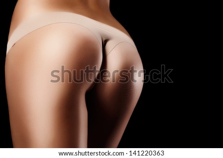 Horizontal Photo Of A Perfect Body On Black Background. Special Care And Attention For The Skin Retouching.
