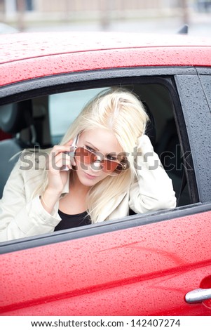 Blond Woman In New Red Car On Test Drive.
