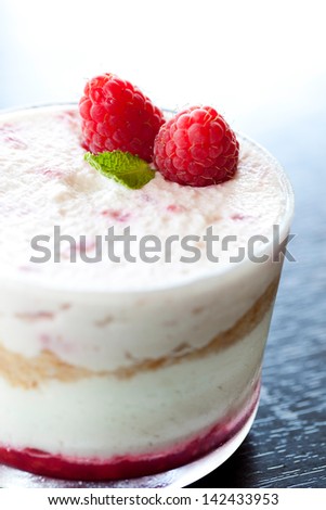 Detail Of Dessert Made Of Ice Cream; Cookies Cream And Raspberry.