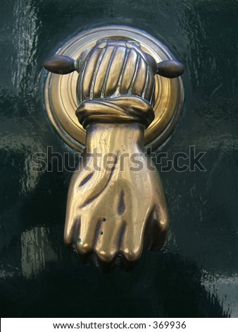 Rusted hand door knocker