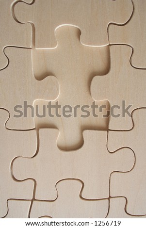 Wooden jigsaw with one missing piece