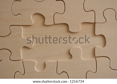 Wooden jigsaw with two empty elements
