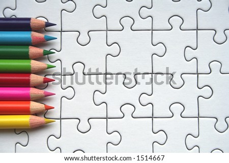 Colorful pencils and jigsaw pattern
