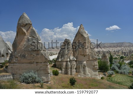 These are Fairy Chimneys rock formation nearby Goreme, in Cappadocia - Turkey. This is  unique geological and historic area.
