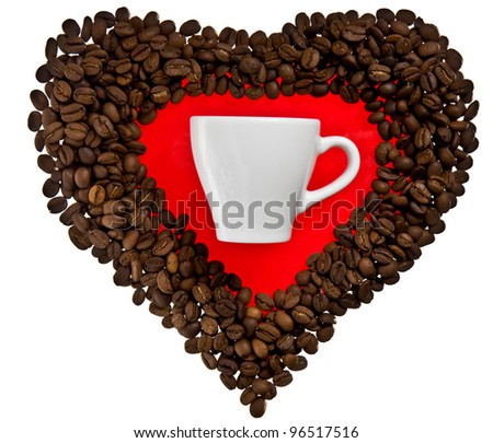 This coffee heart and traditional white cup symbolize love of coffee. The isolated composition is placed over the white background.