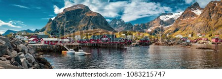 Panorama of A - village, Moskenes, on the Lofoten in northern Norway. Norwegian fishing village, with the typical rorbu houses.  Mountain In Background