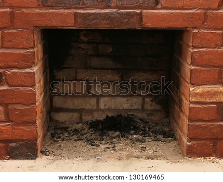 Backdrop of a brick fireplace wall in a vacant setting