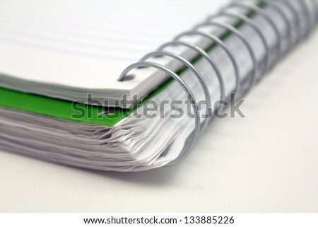 spiral bound lined note book with close up of metal spirals