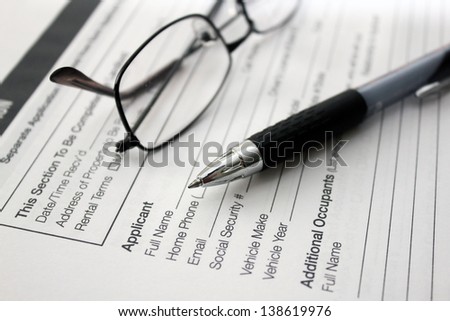 close up of rental application with pen