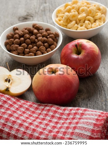 The simple food composition with apples and corn flacks