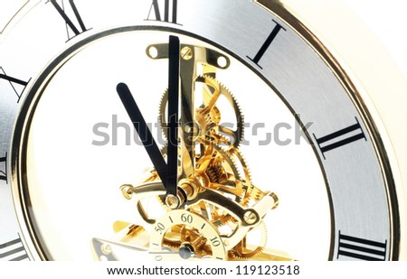 Gold table clock on a white background