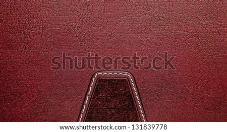 Red leather label with seam
