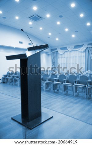 Modern auditorium hall for presentation with tribune