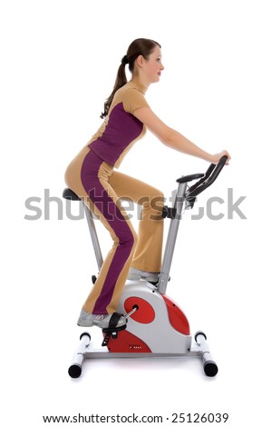 Attractive woman doing fitness on a stationary bike isolated on white