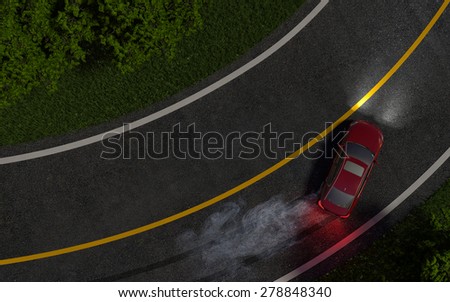 red car enters the turn with skid. night