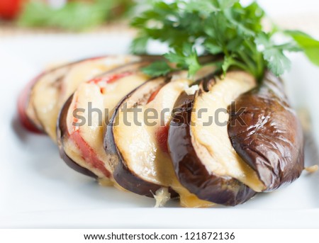 baked eggplant with cheese sauce, close-up food