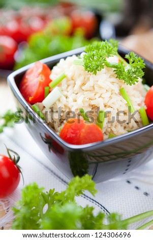 cooked brown rice and cherry tomatoes, close up