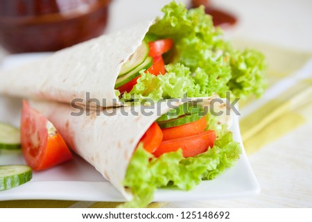 thin pita bread with lettuce and tomato, closeup