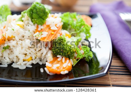 rice with roasted carrots and broccoli, closeup