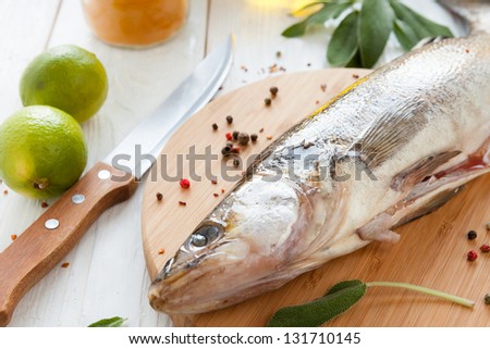 raw fish close-up on chopping board, zander