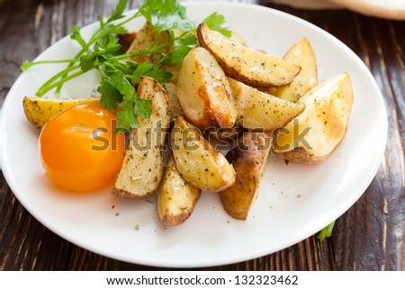 Baked potato wedges in the oven, closeup