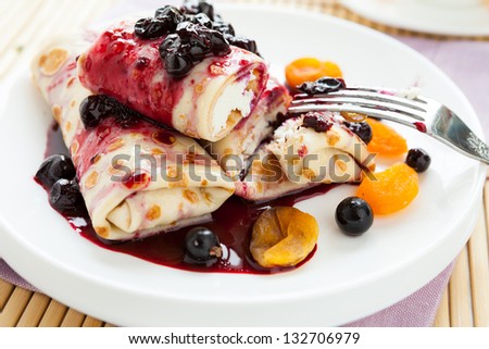 dessert pancakes with cottage cheese and berry jam, closeup