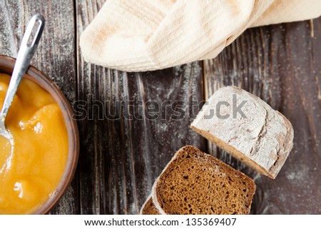 buckwheat honey in a bowl and rye bread, food closeup