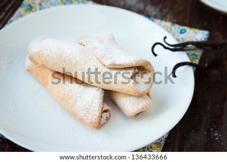 small rolls with vanilla and powdered sugar, buns closeup