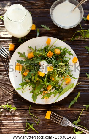 salad with rocket salad and yogurt, food closeup