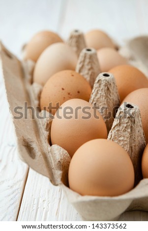 farm fresh eggs in a cardboard tray, food close up