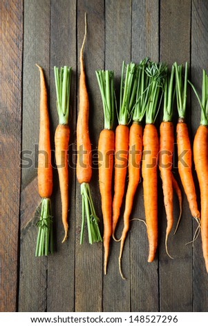 baby carrots on wooden boards, top view, food