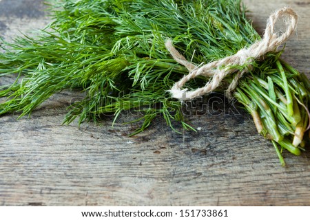 bunch of dill on old boards, fresh herbs