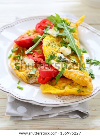 scrambled eggs with paprika and blue cheese, food closeup