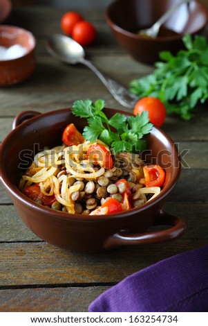 Green lentils with vegetables, food closeup