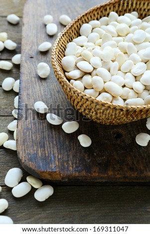 raw white beans in a basket, food closeup