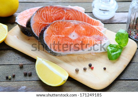 fresh salmon fillet on a board, food closeup