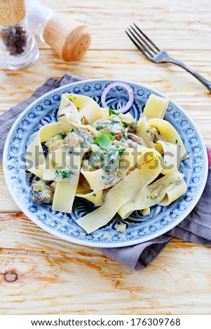 appetizing pasta with fried porcini mushrooms, food closeup