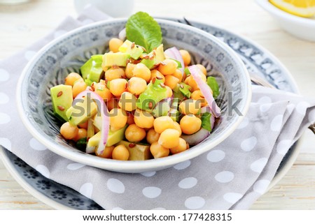 salad with chickpeas and avocado, food closeup