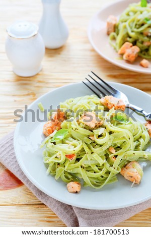 nourishing spaghetti with salmon slices, food closeup