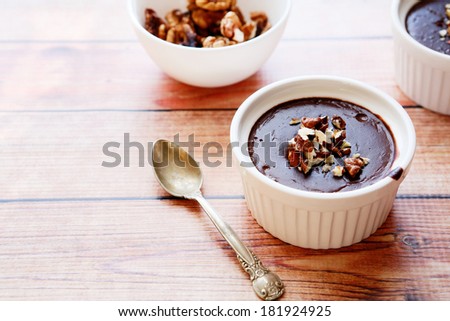 chocolate mousse with walnut pieces, food closeup