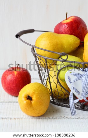ripe pears and apples in basket, food closeup